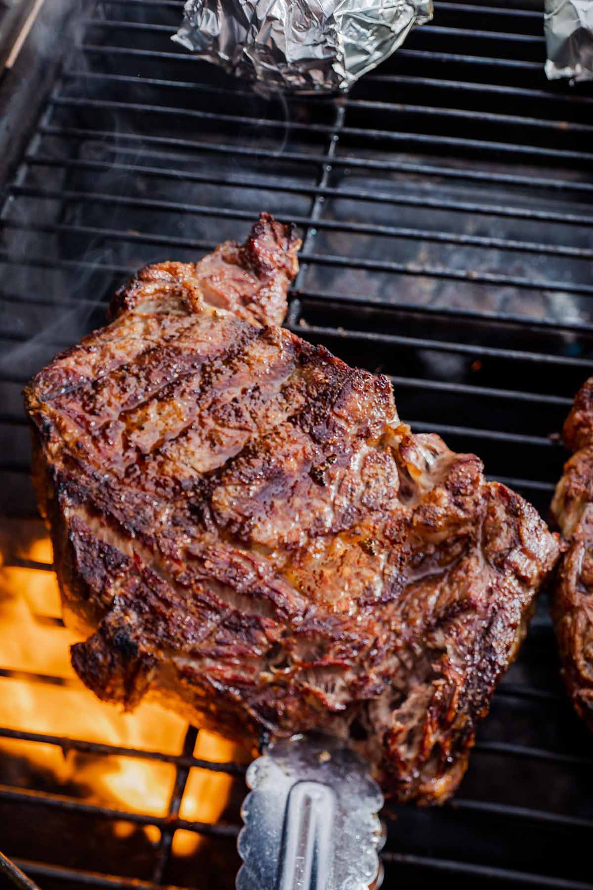 ribeye steaks on the grill