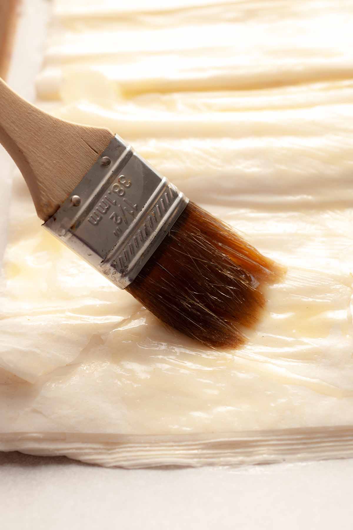 Use pastry brush on phyllo dough